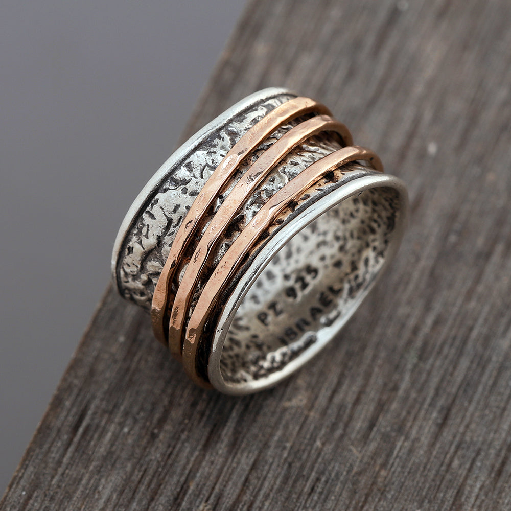 Spinner ring the deals is made of sterling silver and gold